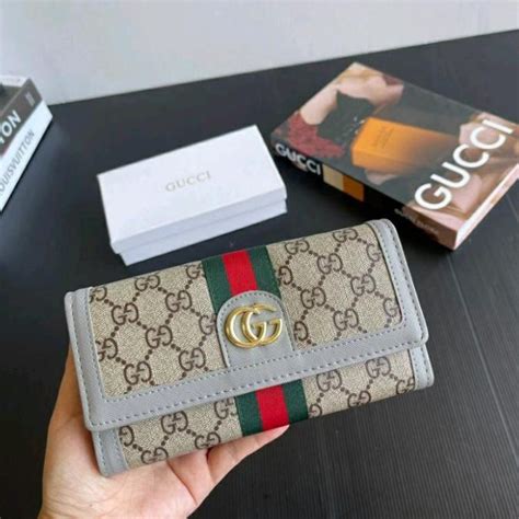 farfetch carteras gucci.